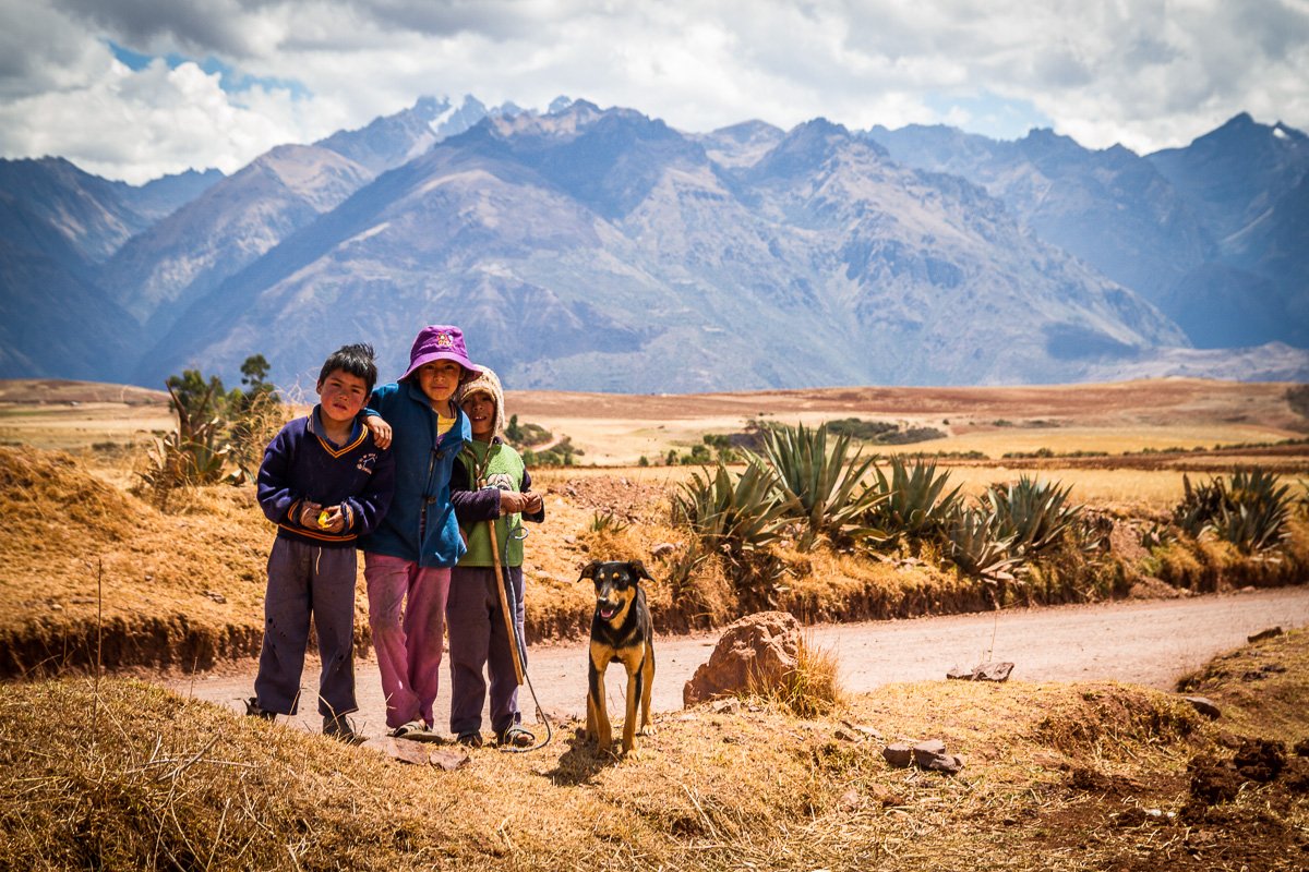 Children in the mountains and dog