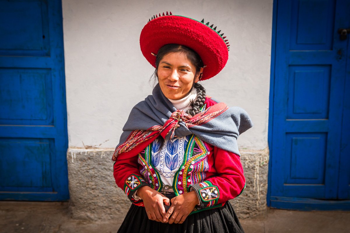 Peruvian woman hat blue doors